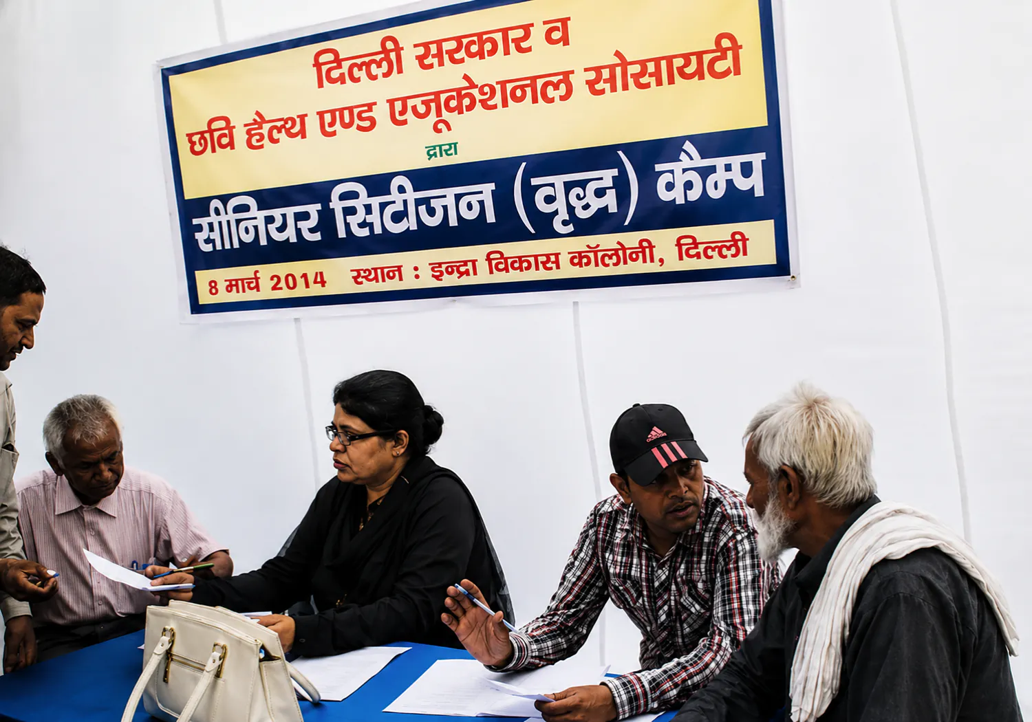 Elderly residents being registered at a CHES senior citizens camp in Indira Vikas Colony