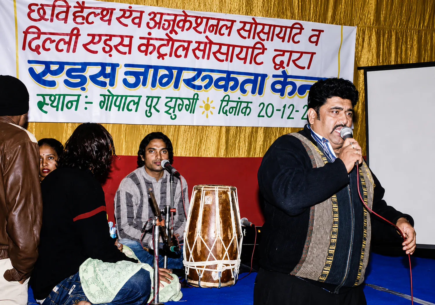 A CHES HIV/AIDS awareness event with a speaker addressing the audience